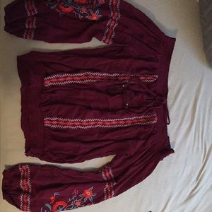 Native style maroon shirt.